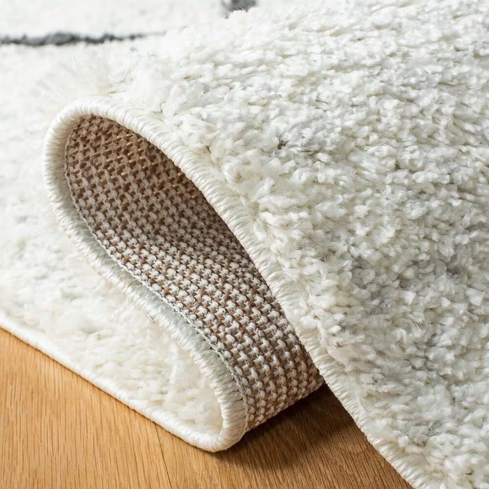 106286-safavieh-august-shag-aug572a-9-x-12-ivory-and-black-area-rug-1.jpg