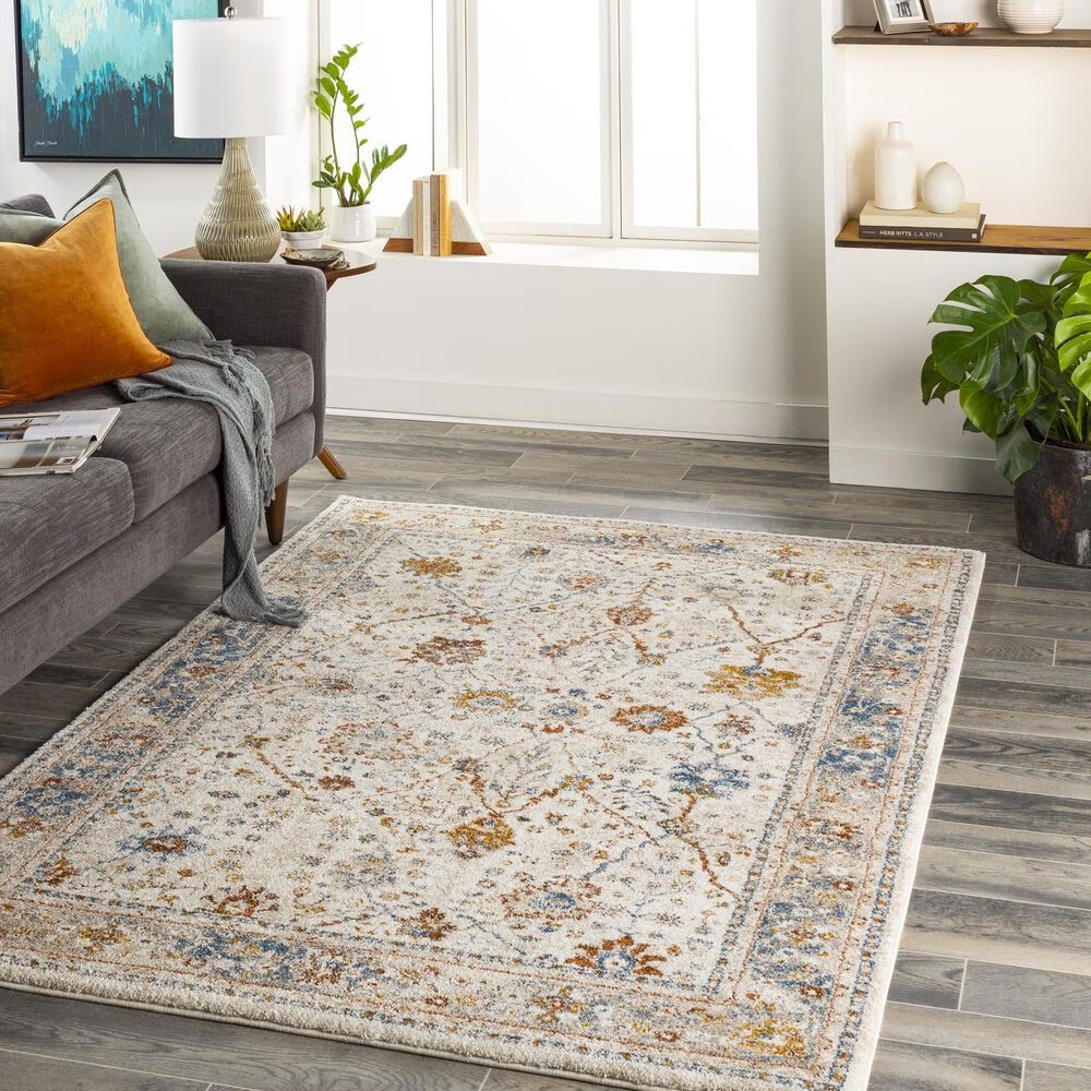 115606-surya-tuscany-6-7-x-9-6-beige-blue-and-rust-area-rug-1.jpg