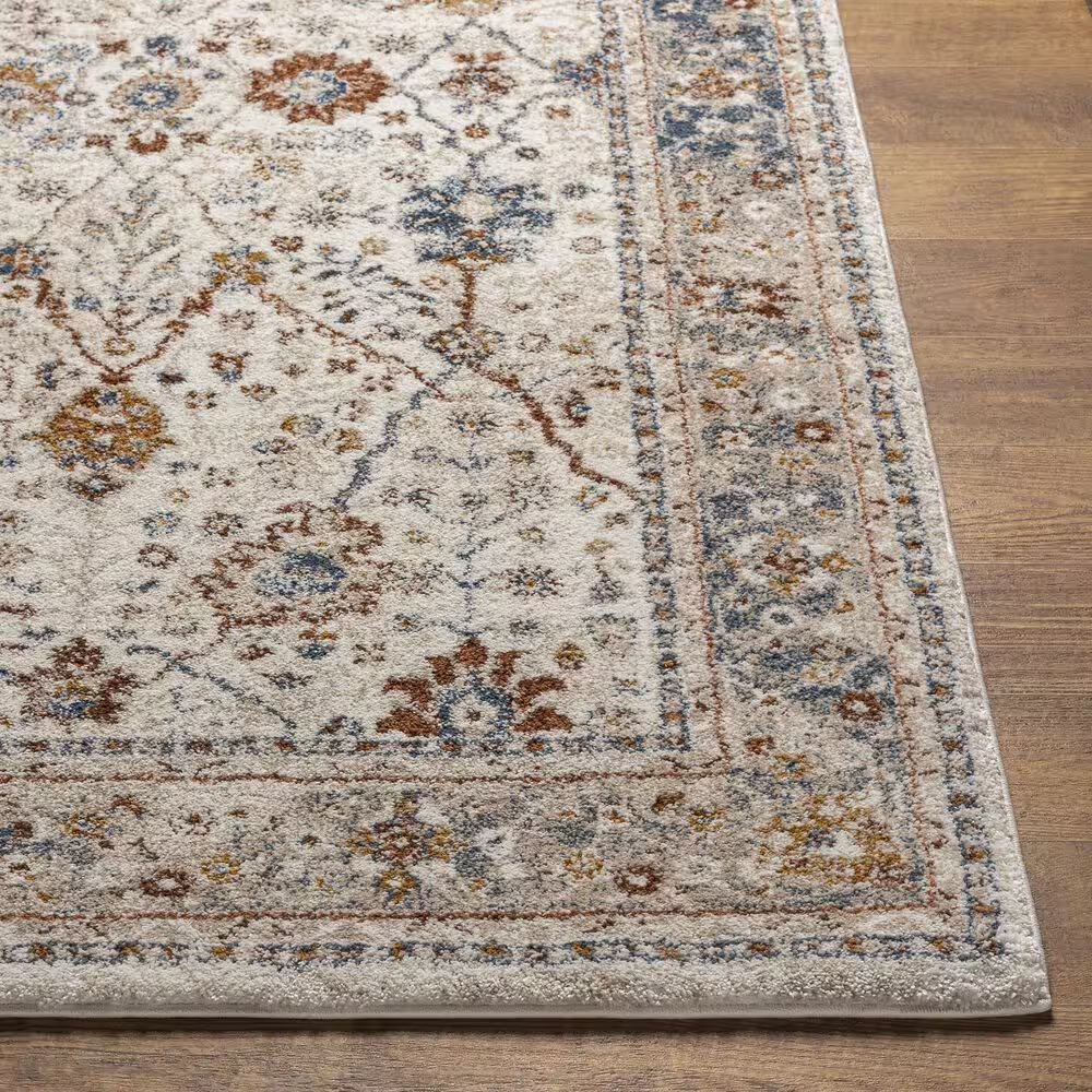 115606-surya-tuscany-6-7-x-9-6-beige-blue-and-rust-area-rug-1.jpg