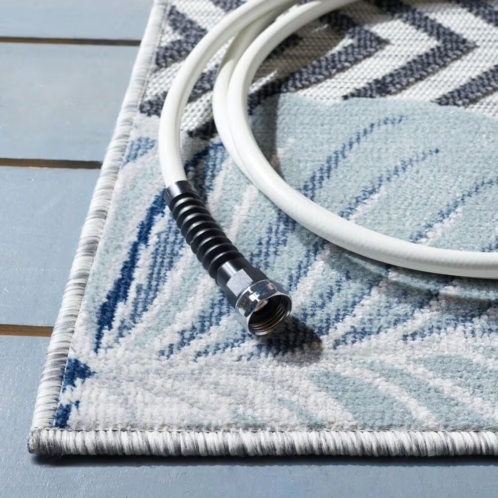 118824-safavieh-cabana-cbn447n-9-x-12-ivory-and-navy-indoor-outdoor-area-performance-rug-1.jpg