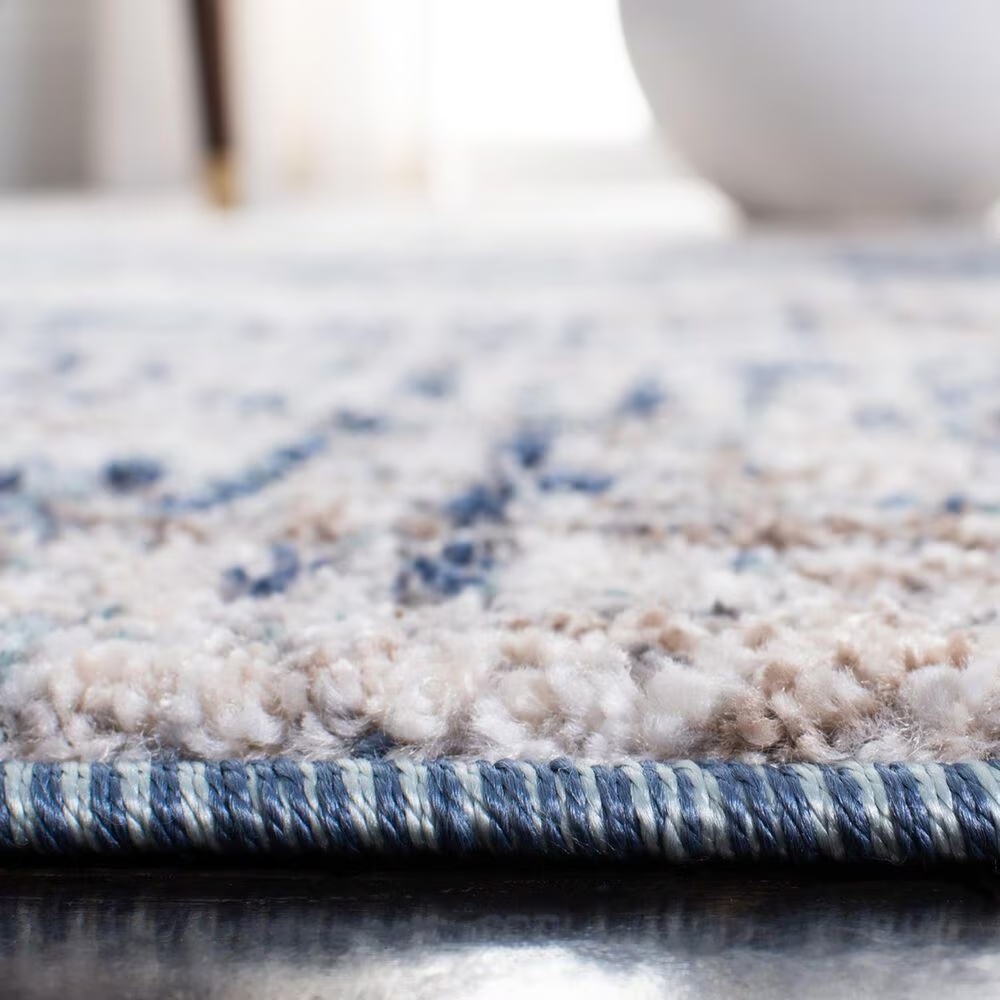 129921-safavieh-aston-asn712-9-x-12-grey-and-navy-area-rug-1.jpg
