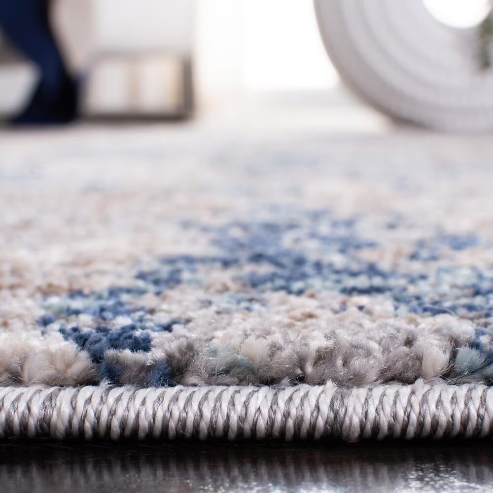 129922-safavieh-aston-asn718-10-x-14-grey-and-navy-area-rug-1.jpg