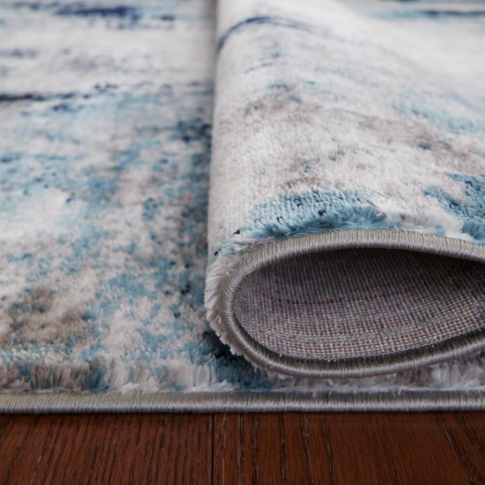 157622-ashley-leonelle-7-10-x-10-cream-blue-and-gray-area-rug-1.jpg