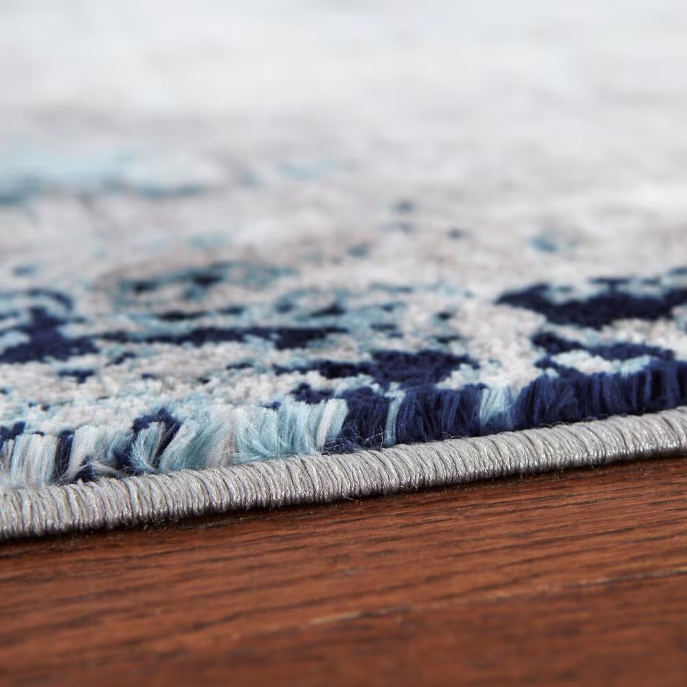 157622-ashley-leonelle-7-10-x-10-cream-blue-and-gray-area-rug-1.jpg