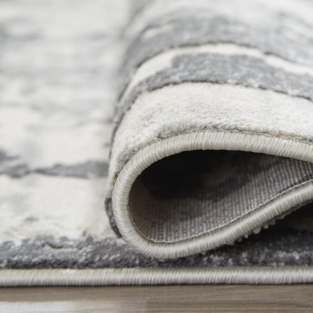 157625-ashley-mazatl-7-10-x-10-2-gray-and-cream-area-rug-1.jpg