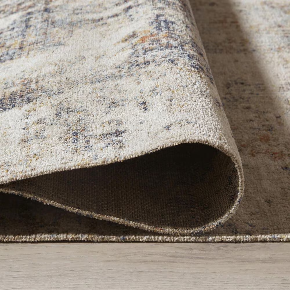 157680-ashley-jerelyn-7-10-x-10-gray-ivory-and-orange-indoor-outdoor-area-rug-1.jpg