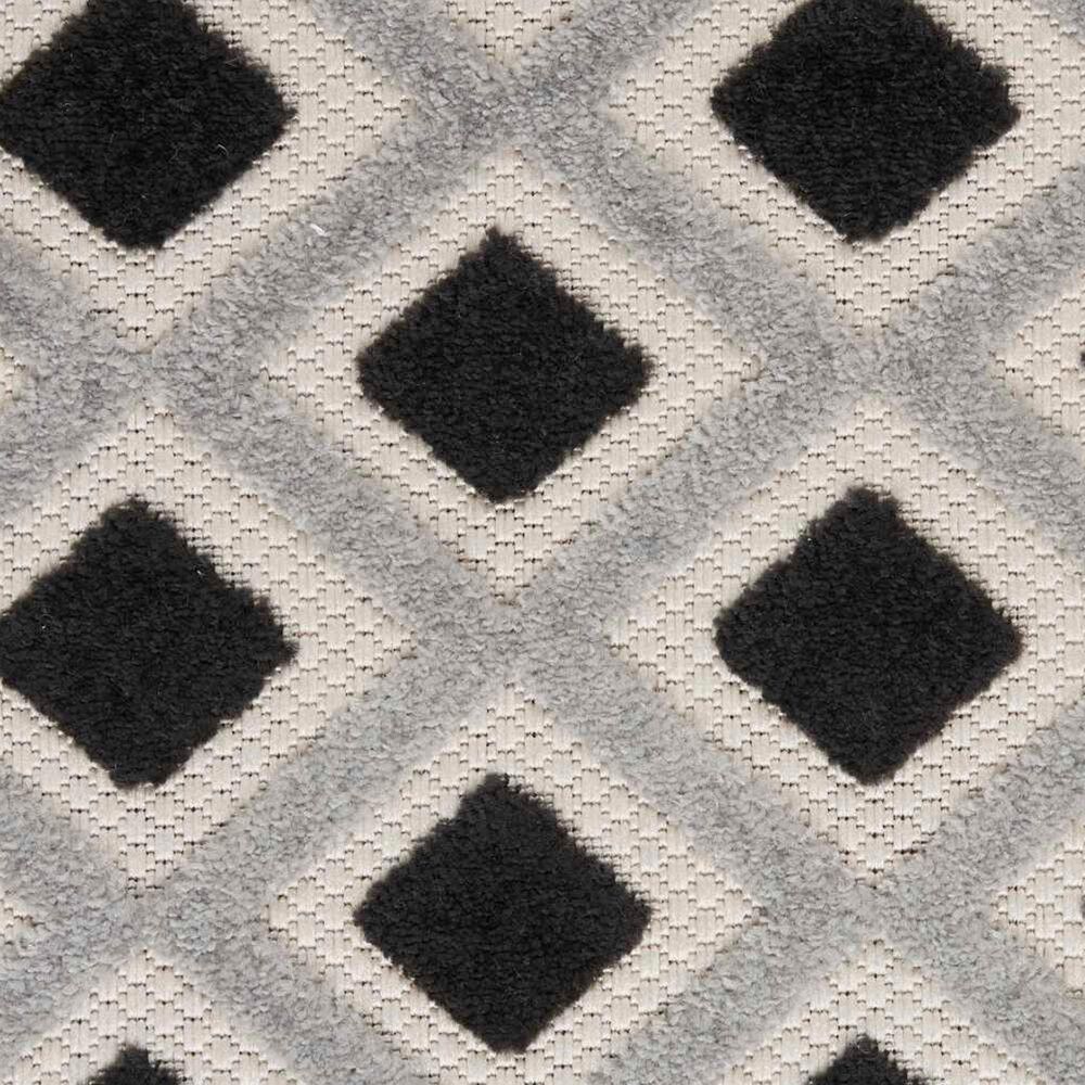 181450-nourison-aloha-geometric-5-3-round-black-and-white-indoor-outdoor-area-rug-1.jpg