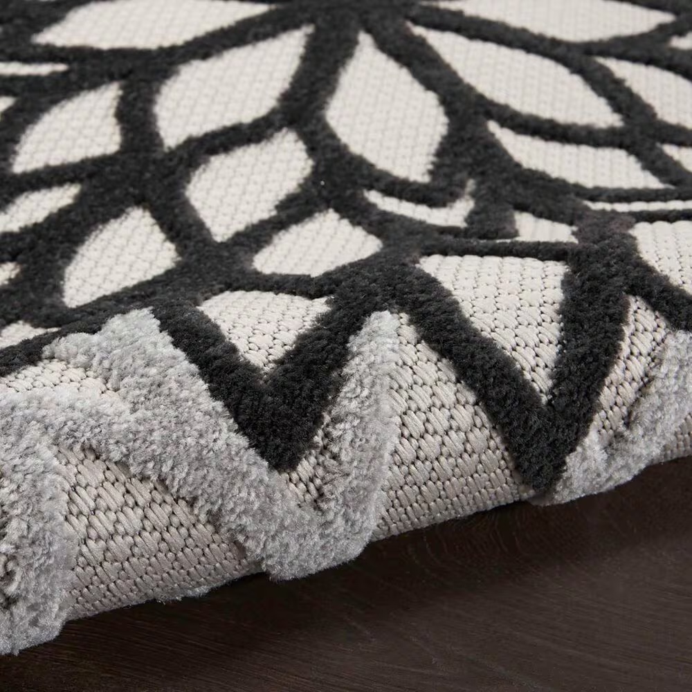 181511-nourison-aloha-floral-7-10-round-black-and-white-indoor-outdoor-area-rug-1.jpg