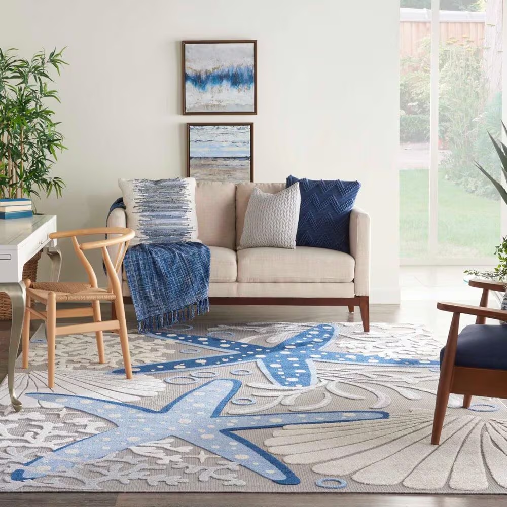 181830-nourison-aloha-9-6-x-13-cool-grey-blue-white-and-ivory-indoor-outdoor-area-rug-1.jpg