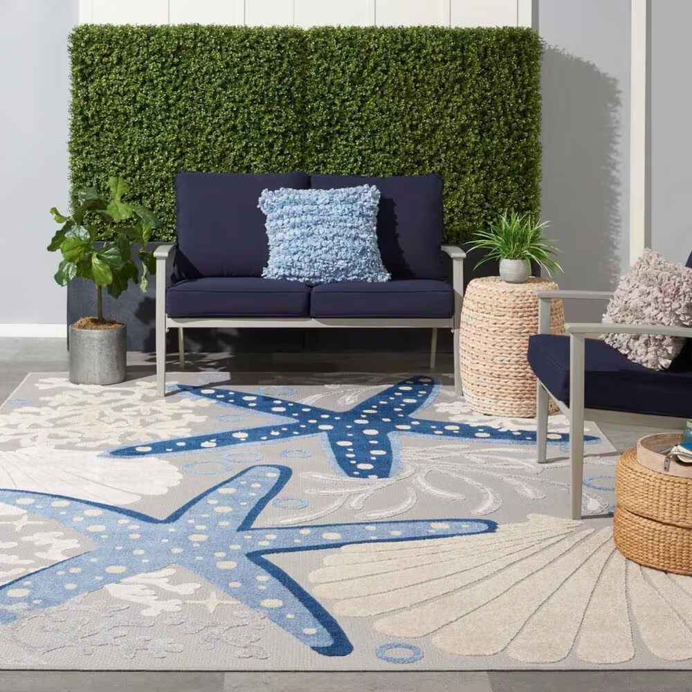 181830-nourison-aloha-9-6-x-13-cool-grey-blue-white-and-ivory-indoor-outdoor-area-rug-1.jpg