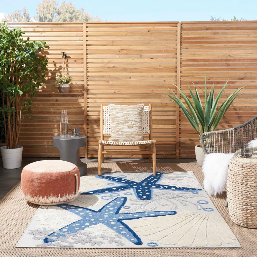 181830-nourison-aloha-9-6-x-13-cool-grey-blue-white-and-ivory-indoor-outdoor-area-rug-1.jpg