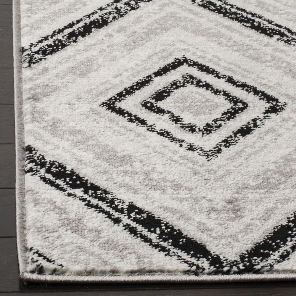 46849-safavieh-skyler-sky120j-2-x-6-grey-and-black-scatter-rug-1.jpg