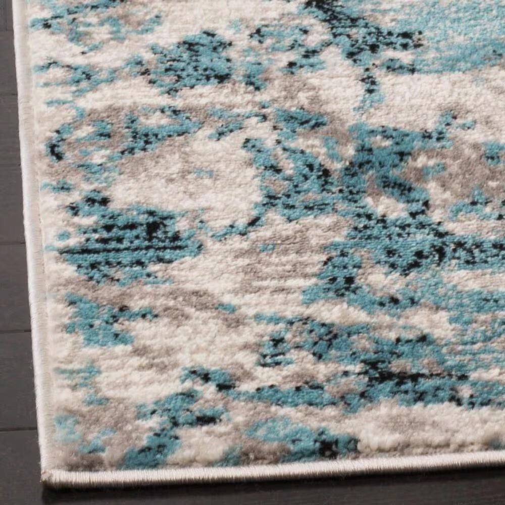 50545-safavieh-skyler-sky186m-5-1-x-7-6-blue-and-ivory-area-rug-1.jpg
