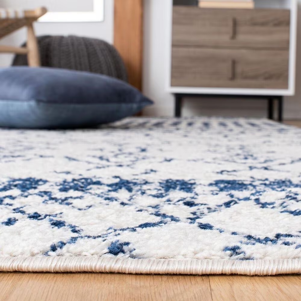 81650-safavieh-tulumtransitional-9-x-12-ivory-and-navy-area-rug-1.jpg