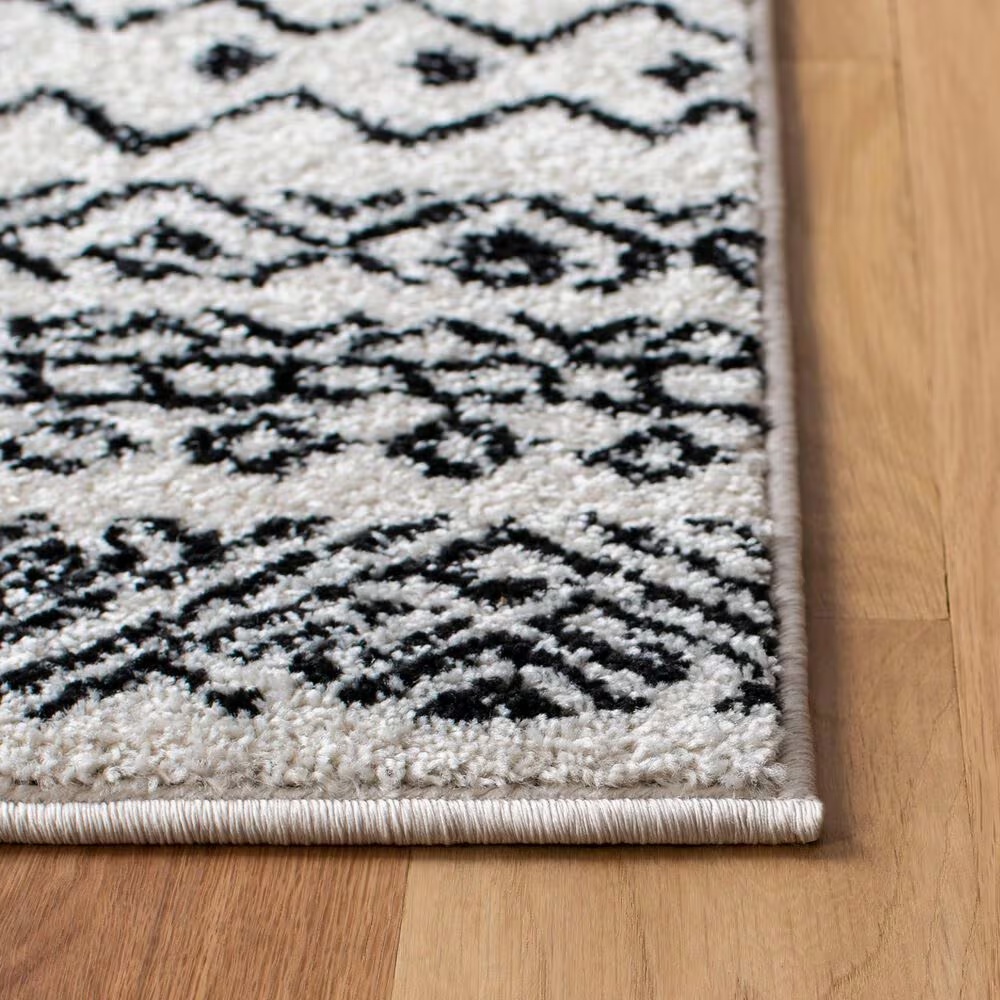 82981-safavieh-tulum-tul267-5-3-x-7-6-ivory-and-black-area-rug-1.jpg