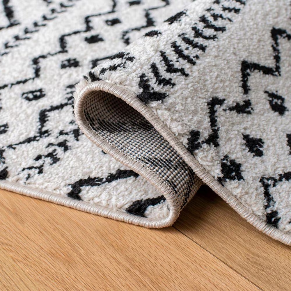82981-safavieh-tulum-tul267-5-3-x-7-6-ivory-and-black-area-rug-1.jpg