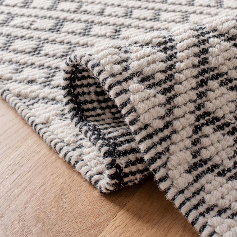 84713-safavieh-natura-nat355a-10-x-14-ivory-and-black-area-rug-1.jpg