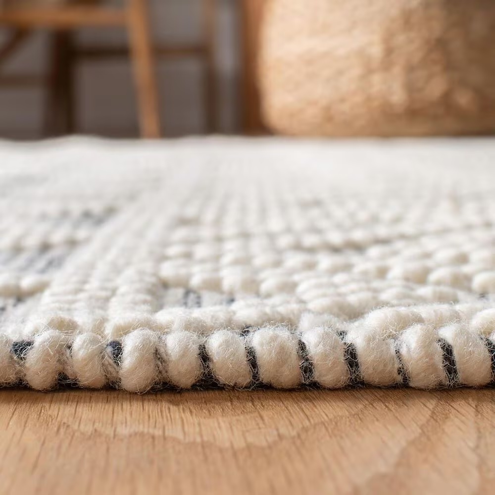 86972-safavieh-natura-nat353a-9-x-12-ivory-and-black-area-rug-1.jpg